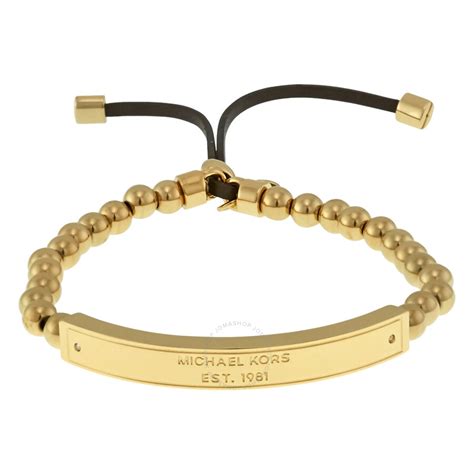 michael kors plaque stretch bracelet yellow gold|Michael Kors bracelet with diamonds.